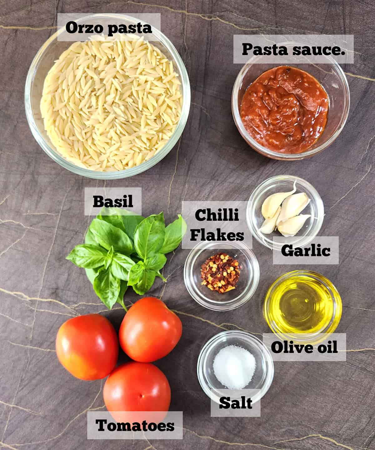 Ingredients used to make the best orzo recipe with tomatoes and basil. 