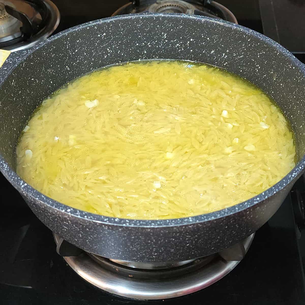 Add water or broth to cook orzo. 