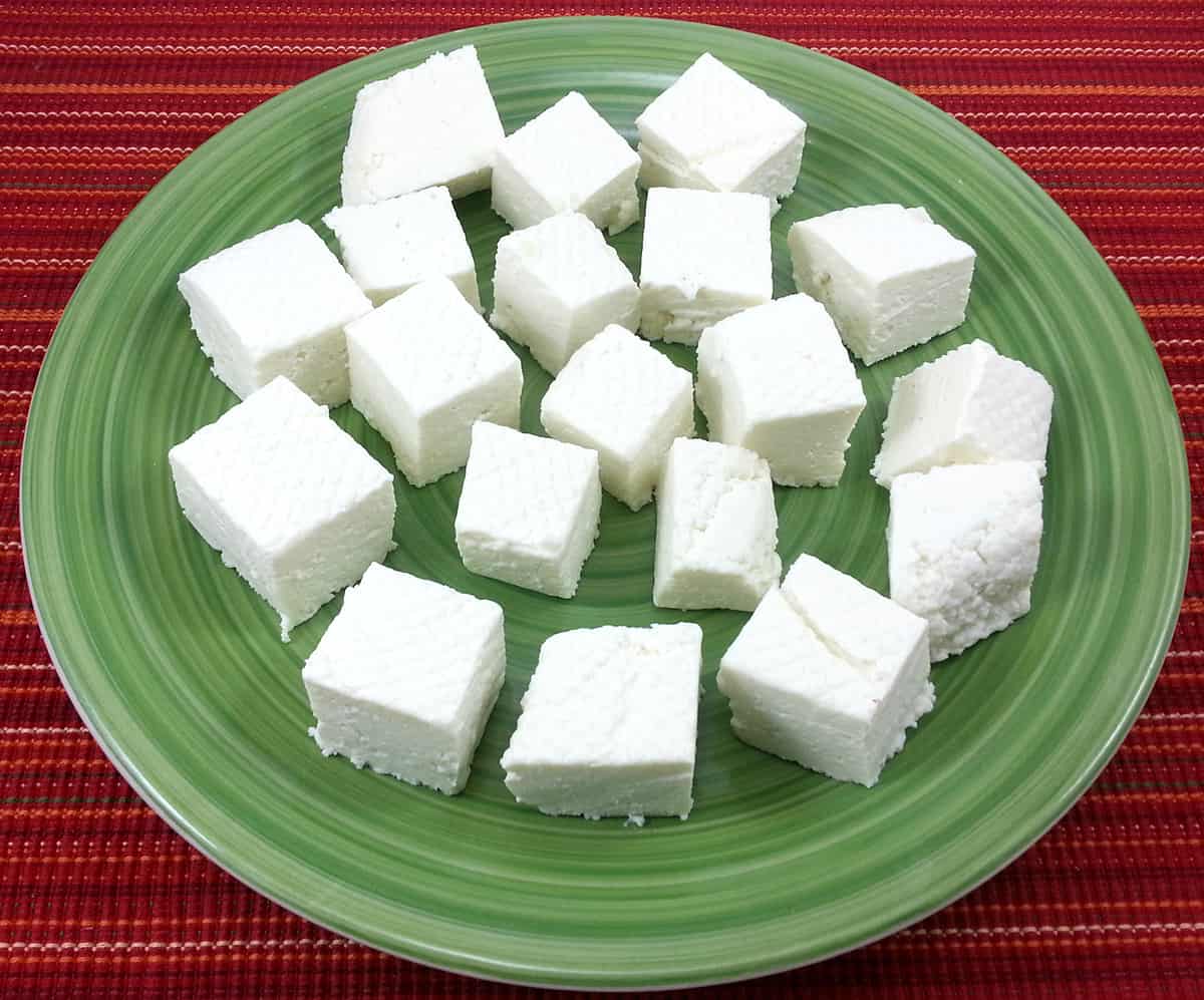 Paneer cubes on a plate ready to use to make any Indian vegetarian curry, tikka, sweets, desserts