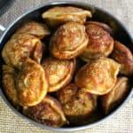 Instant sweet banana paniyaram (appam, appe, paddu) in a pan. Indian evening snack or dessert.