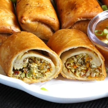 Crispy fried spring rolls or vegetable spring rolls with sweet chili sauce (lumpia).