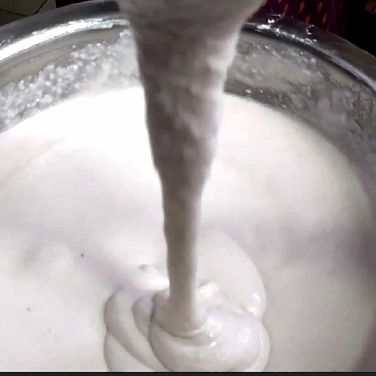 Showing the perfect soft idli batter consistency before fermentation.