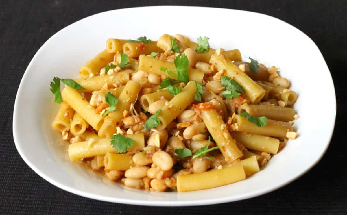 Asian flavored pasta recipe with roasted peanuts, soy sauce, ziti pasta and white beans.