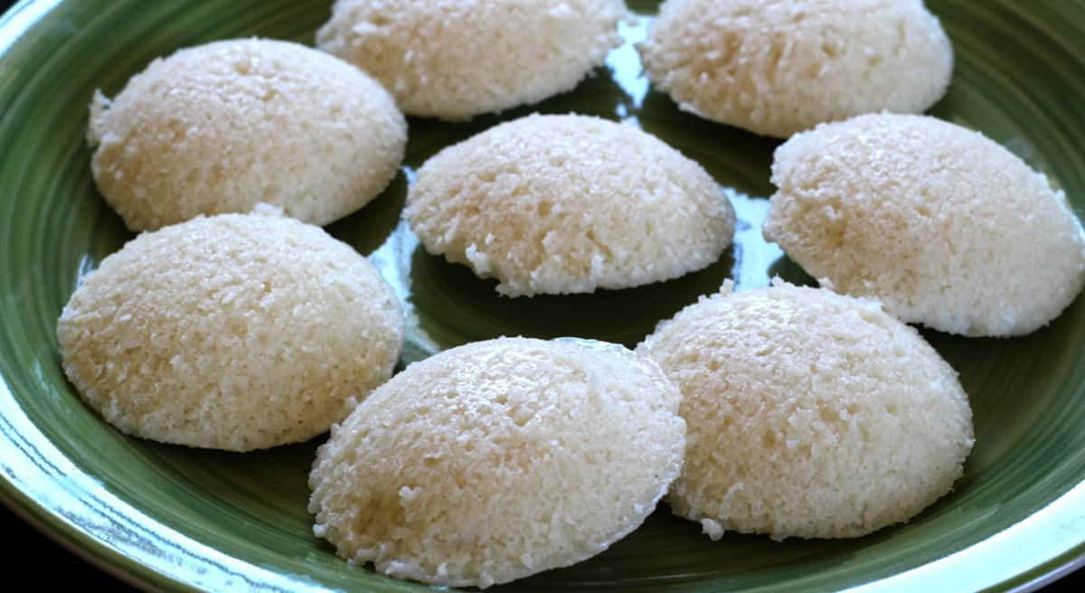 close up of soft idlis (idly) on a serving plate. 