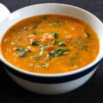 Vegan Spinach curry with lentil and coconut. Indian dal palak recipe. Coconut lentil curry.