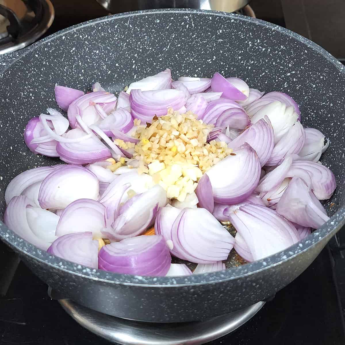 Add onions, fresh garlic and ginger chopped. 