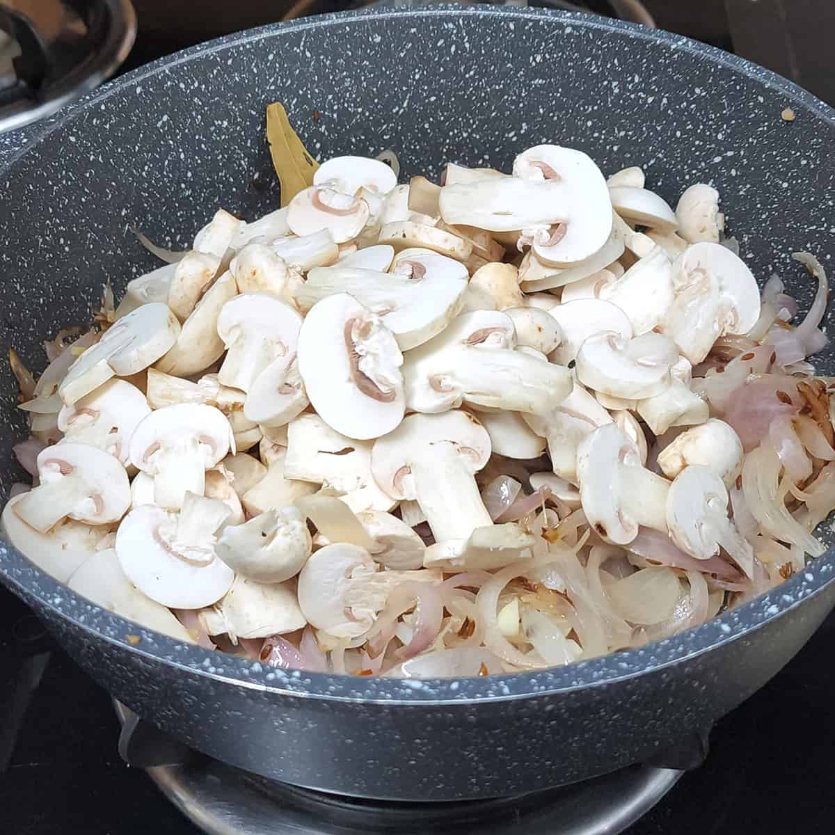 Add sliced mushrooms. 