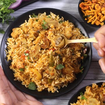 Best and simple vegetarian Mushroom biryani served on a plate with raita.