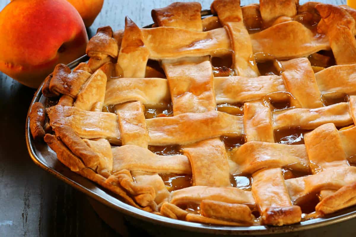 lattice pie crust with peach pie filling. 