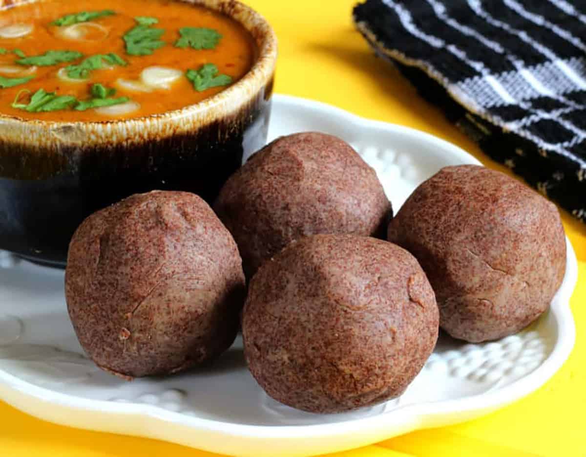 Ragi mudde (Finger Millet balls) served with bassaru. 