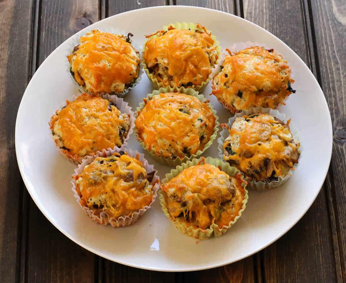 Quick and easy savory muffins for breakfast, snack or dinner on a white plate. 