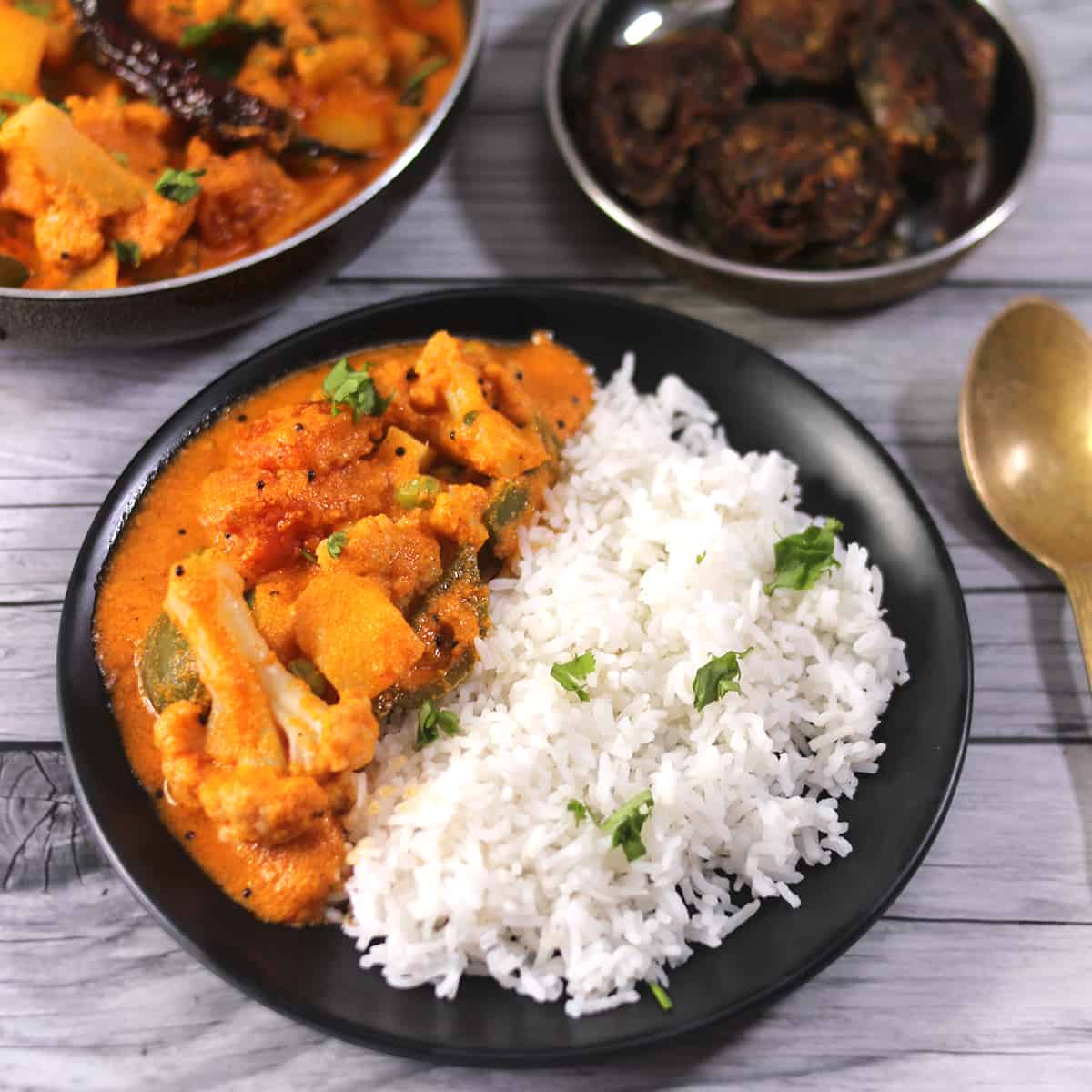 Healthy vegan and vegetarian Indian meals. Potato curry, steamed rice and pathrode.