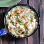 Easy traditional vegetable stew in a black pan served with appam.