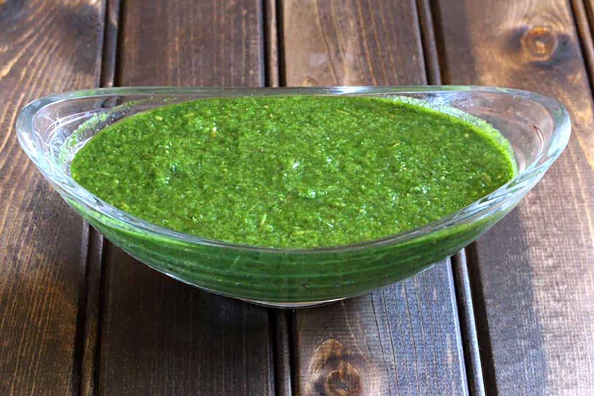 Bowl of fresh green mint and cilantro chutney or hari pudina dhaniya  chutney.