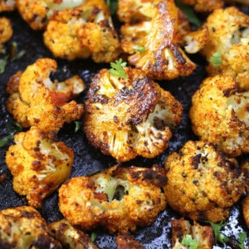 Oven roasted cauliflower - easy baked and roasted crispy cauliflower bites or steaks for dinner.