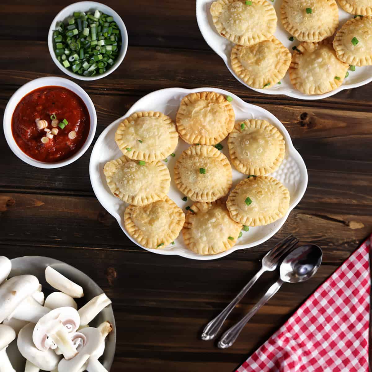 Delicious homemade fried ravioli served in a white plate.