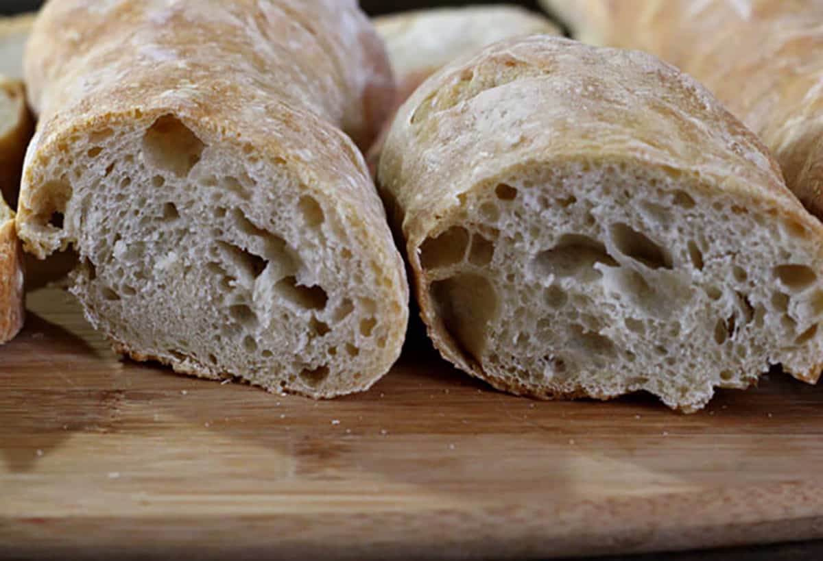 Picture showing the big holes, airy and chewy texture of baguette inside. 