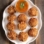 Sabudana vada recipe: Indian snack & finger food served with chutney, aloo rasedar, cup of chai.