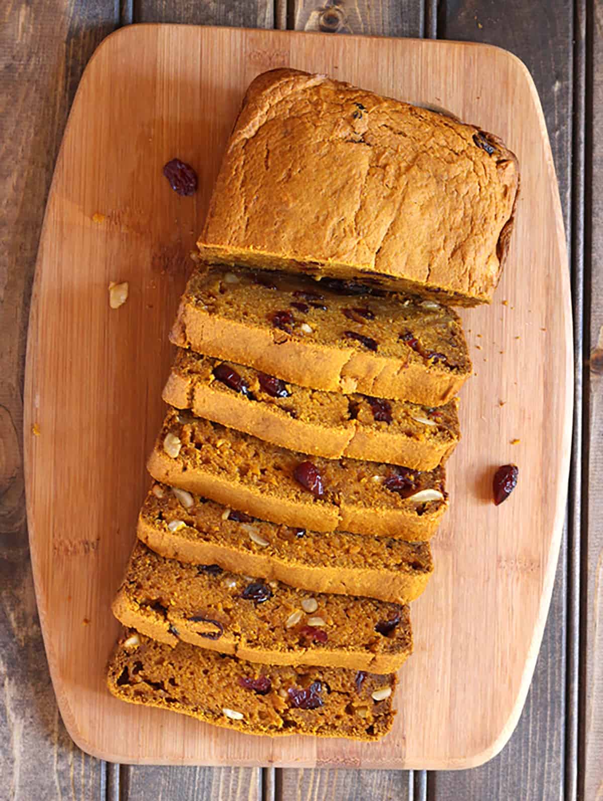 Healthy pumpkin bread recipe with cranberries and nut. Festive fall and holiday bread loaf. 