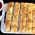 Best Garlic Breadsticks recipe, homemade from scratch with pizza dough. Easy dinner side, appetizer.