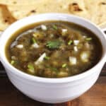 Easy roasted eggplant dip garnished with onions and cilantro.