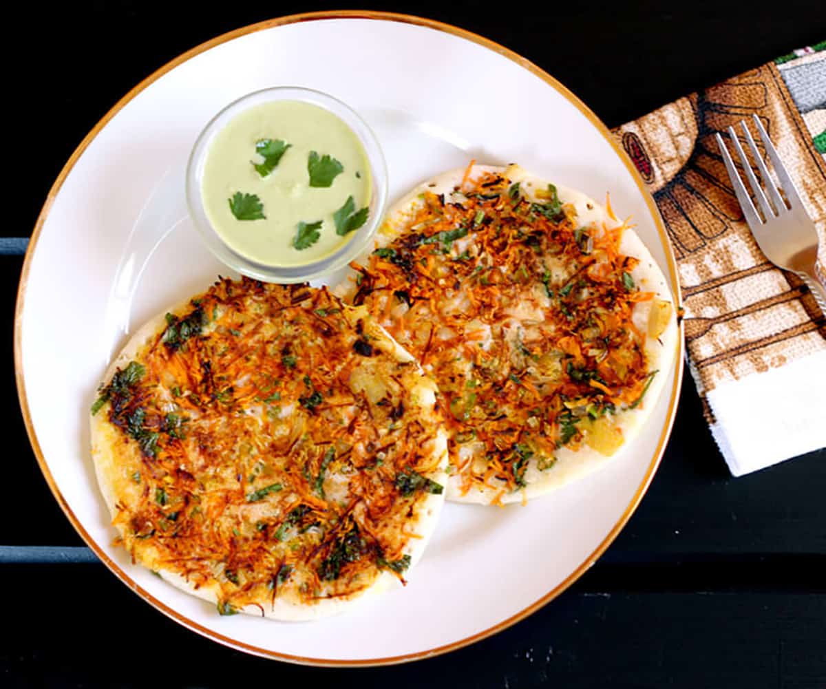 Mixed vegetable uttapam served with chutney 