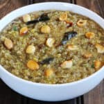 healthy, easy quinoa venn pongalfor weight loss served in a white bowl.