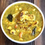 Healthy and easy cauliflower lentil curry (dal) in a white serving bowl.