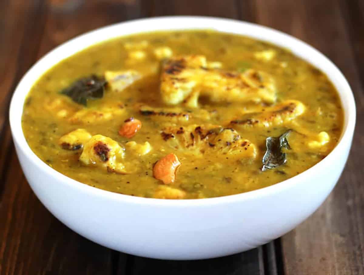 best Indian cauliflower dal or lentil curry in a white serving bowl. 