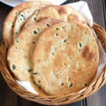 Best homemade flatbread with garlic and basil. Simple vegan bread or oven baked naan recipe.