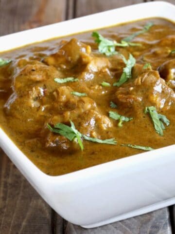 Easy and Delicious Chicken Kali Mirch served in a square white ceramic bowl.