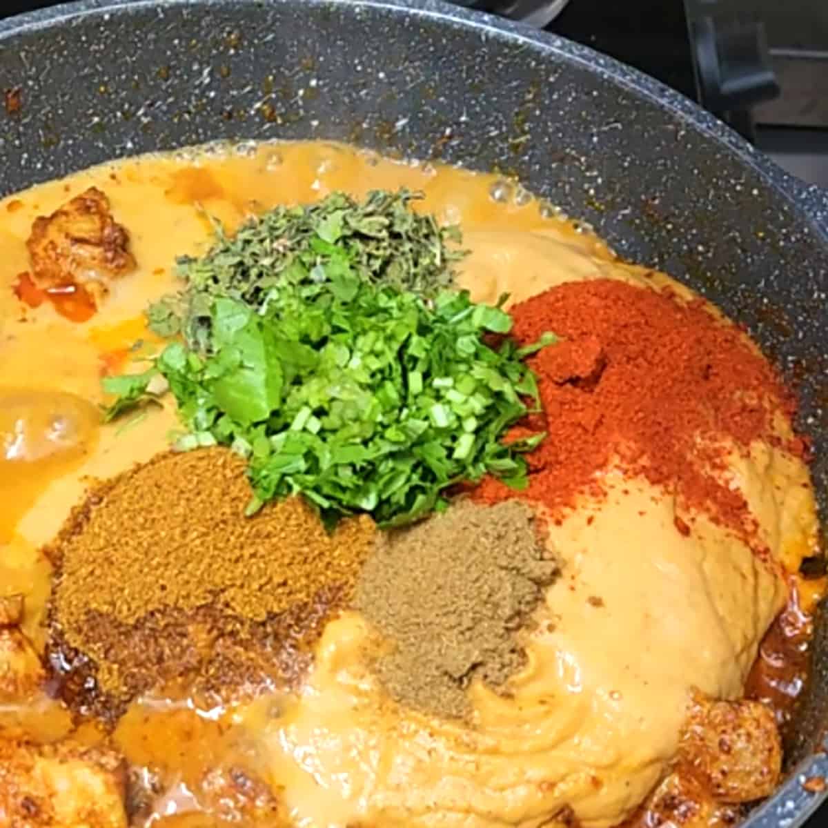 Add all the spice powders to make butter chicken sauce. 