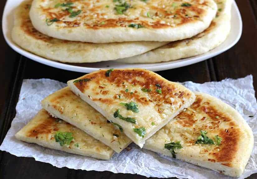 Garlic Cheese Naan Bread, naan recipe, Restaurant style naan bread, simple and easy naan recipes,  garlic naan, butter naan, paneer naan, cheese naan, stuffed naan, naan vs pita, how to make naan bread at home on cast iron pan, non stick pan, oven, no knead naan dough, easy flatbread recipes for lunch and dinner, cheese garlic stuffed bread, dinner and lunch recipes, popular Indian food recipes 