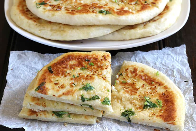 Garlic Cheese Naan Bread, naan recipe, Restaurant style naan bread, garlic naan, butter naan, paneer naan, cheese naan, stuffed naan, naan vs pita, how to make naan bread at home on cast iron pan, non stick pan, oven, no knead naan dough, easy flatbread recipes for lunch and dinner, cheese garlic stuffed bread, dinner and lunch recipes, popular Indian food recipes , naan and curry, naan and gravy
