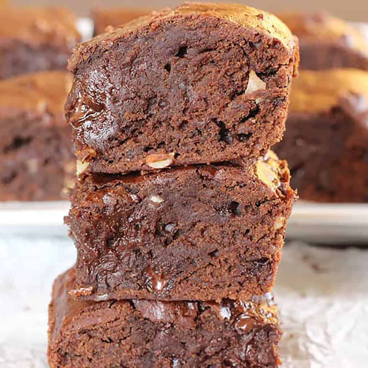 Stack of fudgy, chewy and moist homemade brownies.