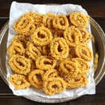 Rice Chakli | Instant Rice Flour Chakli - Crispy deep-fried bite-sized Indian snack recipe.