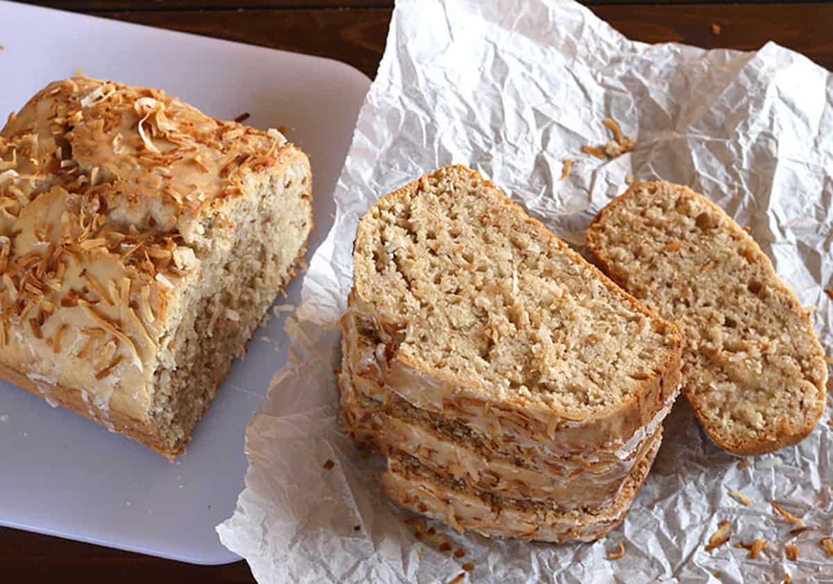 Slices of quick coconut bread. Vegan coconut cake with vanilla glaze. 