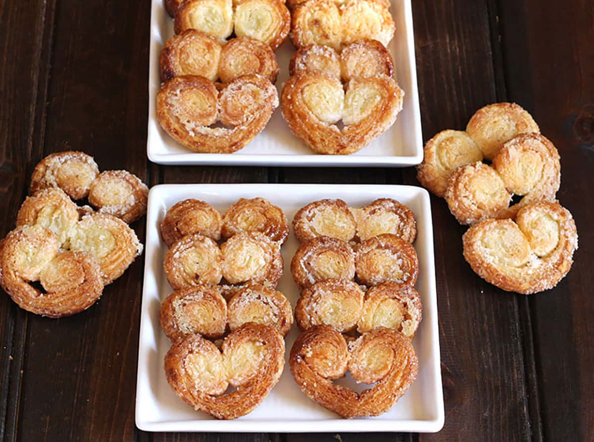 Top view of freshly baked crispy and flaky palmiers, french pastry, butterfly cookies 