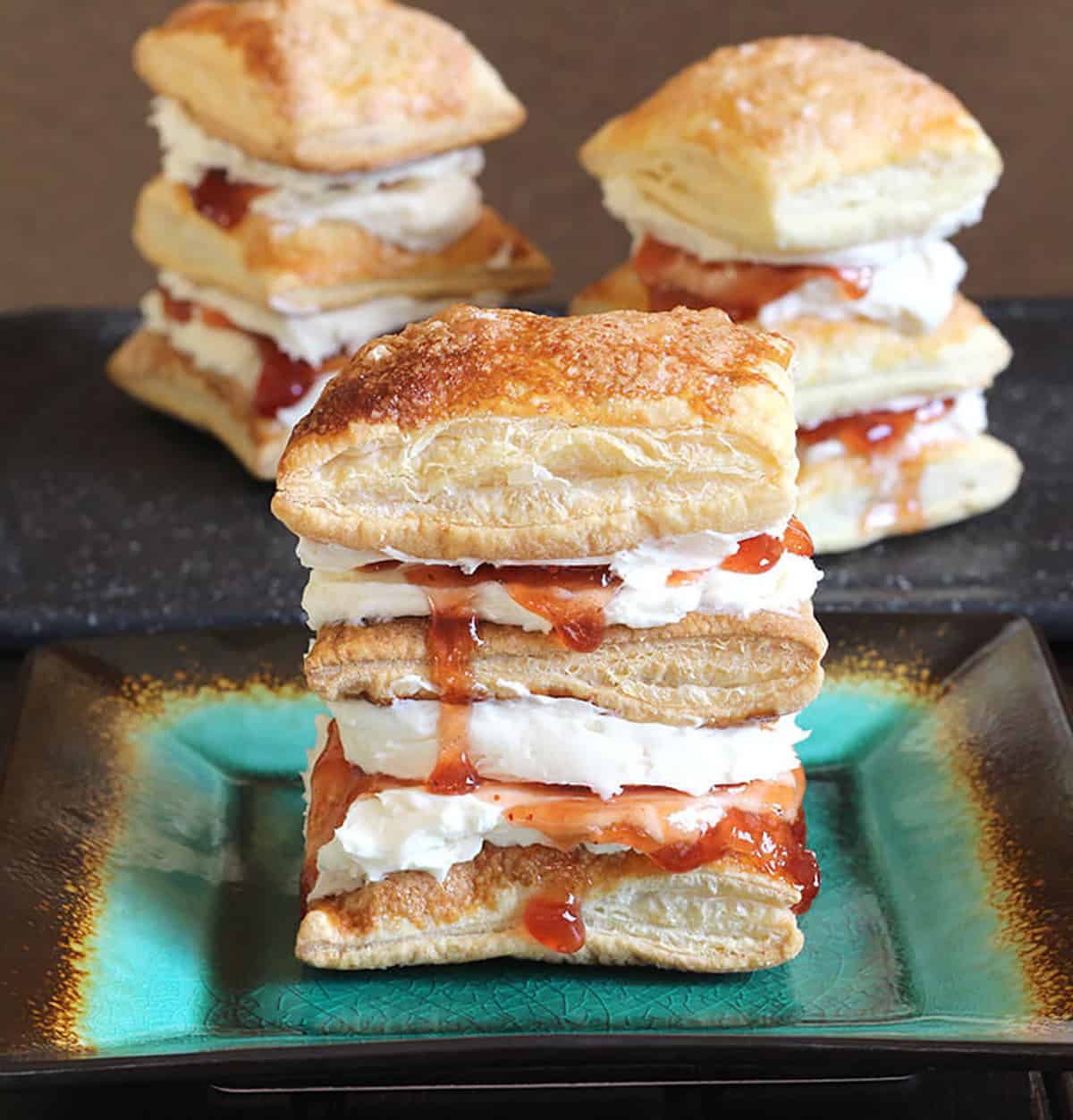Puff pastry layered with pastry cream or butter cream and strawberry jam - napoleon dessert 
