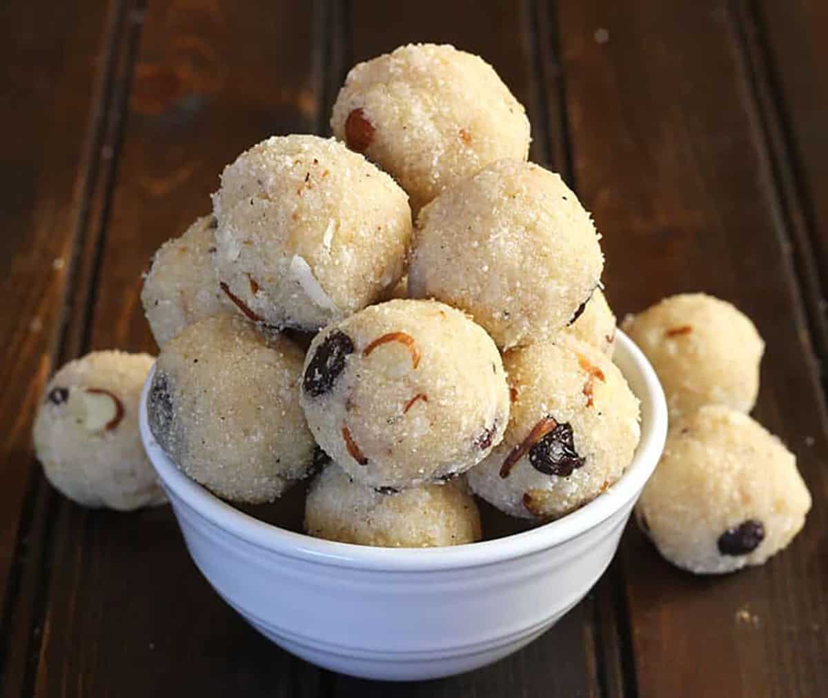 stack of rava laddu mithai (coconut suji rava ladoo) - Quick Indian sweets and desserts. 
