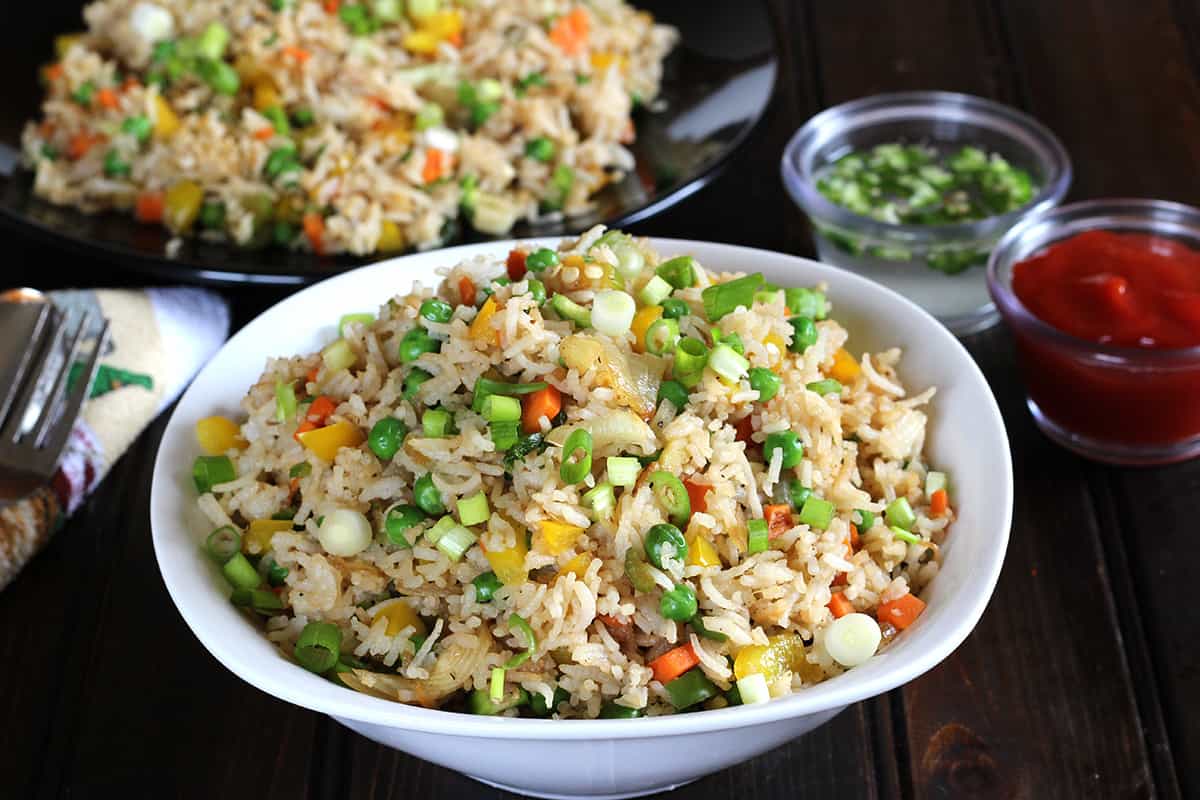 healthy mixed vegetable fried rice in a bowl (best Chinese stir-fried rice).