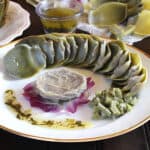 Steamed artichokes (artichoke heart and petals) with garlic butter dipping sauce.