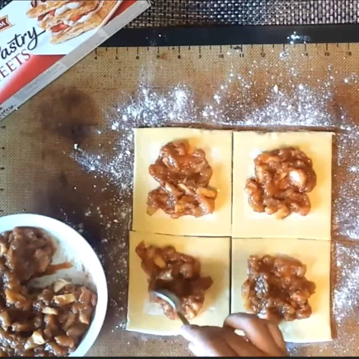 Add the apple tart filling to each individual squares. 