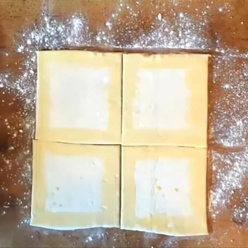 Cut pastry sheet into squares for tarts and egg wash the edges. 