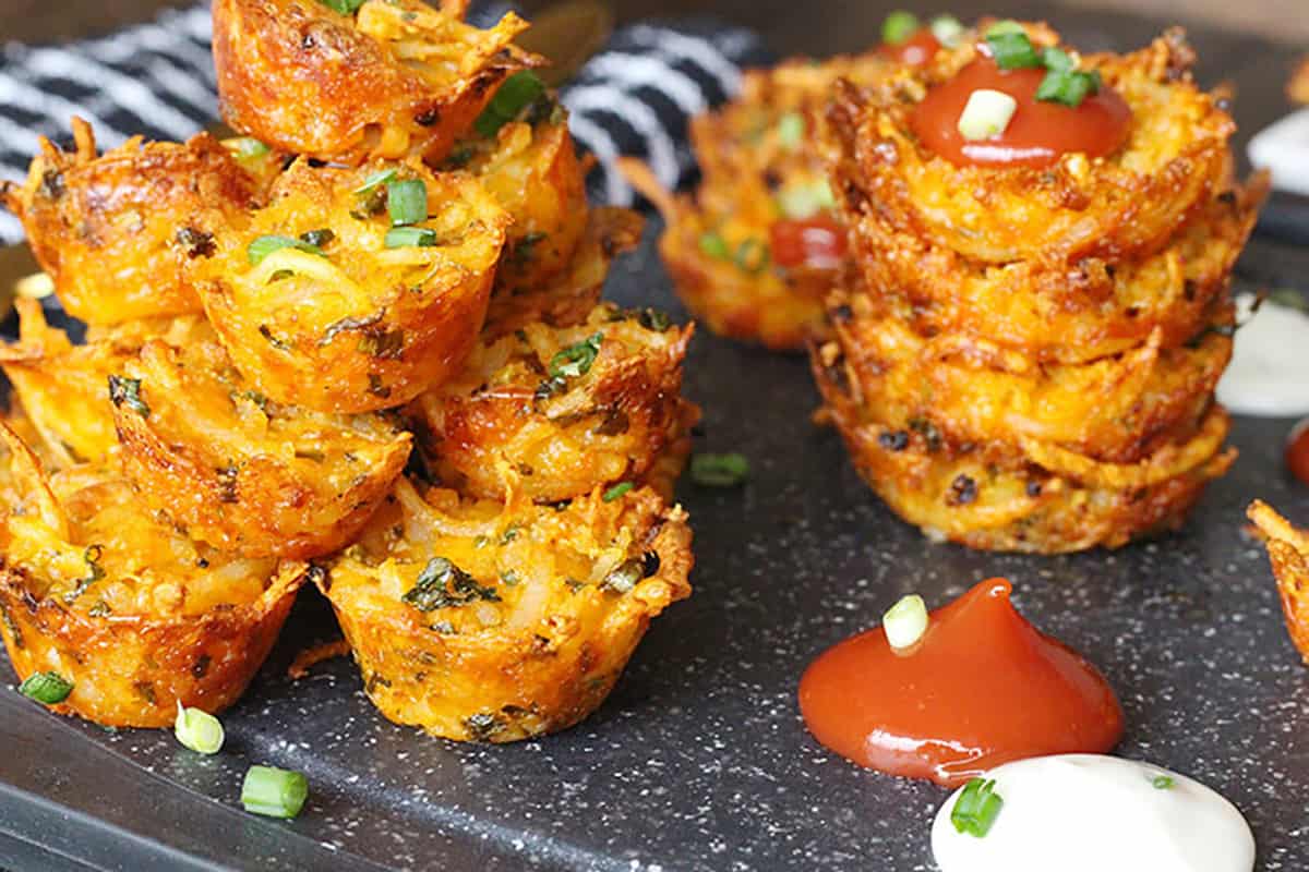 stack of mini cheesy hash brown bites, appetizer for parties, super bowl 