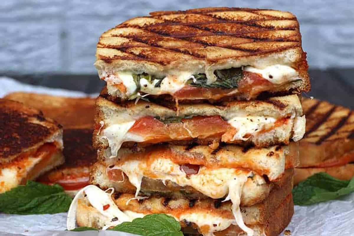 Stack of best grilled margherita sandwich, grilled cheese sandwich, pizza sandwich 