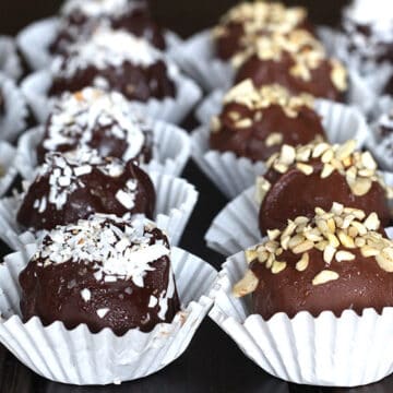 Truffles with leftover cake coated in chocolate and garnished with toasted coconut and nuts.