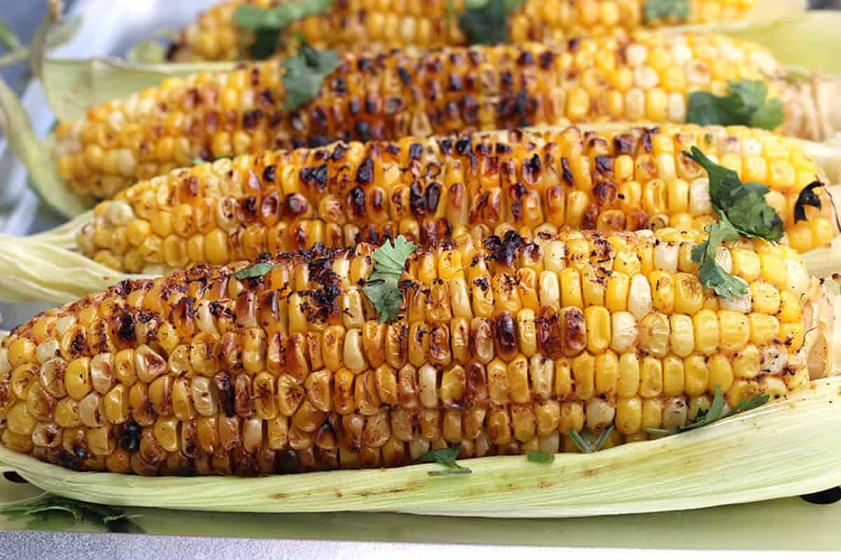 Grilled corn the cob - summer bbq party side dish, appetizer recipe. 