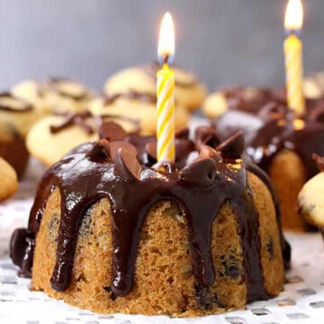 Best, easy and moist chocolate chip bundt cake and mini cupcakes with chocolate glaze and candle.