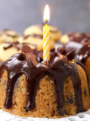 Best, easy and moist chocolate chip bundt cake and mini cupcakes with chocolate glaze and candle.